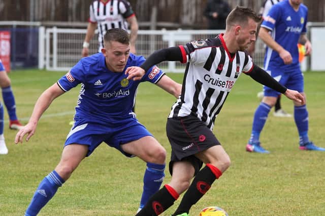 Elliot Newby keeps hold of possession for the Magpies against Peterborough