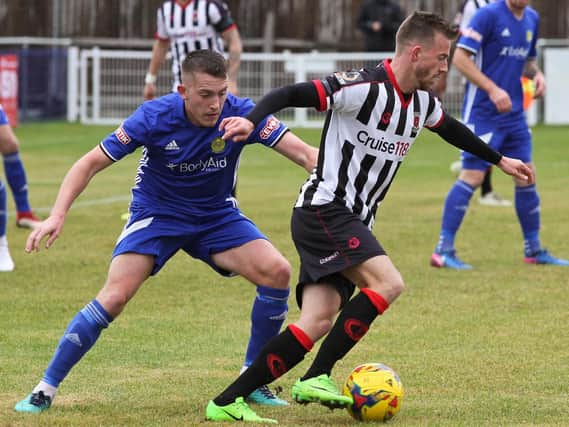 Elliot Newby keeps hold of possession for the Magpies against Peterborough
