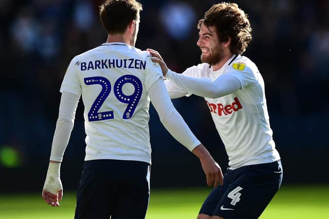 Tom Barkhuizen is congratulated by Ben Pearson after giving Preston the lead against Wigan