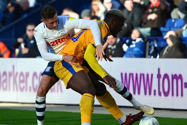 Alan Browne tussles for possession against Wigan