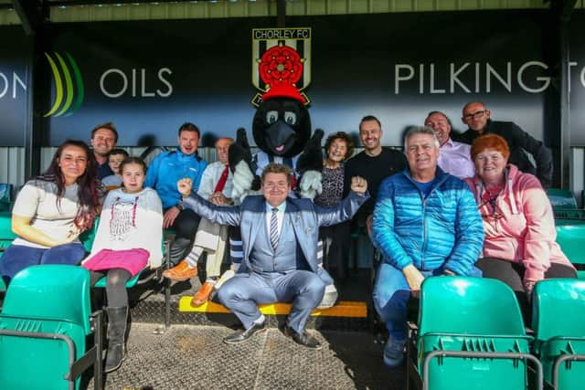 Family and friends from Pilkington Oils celebrate the grand opening