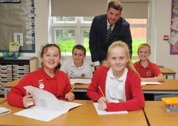 LEP - CHORLEY  05-10-18
Deputy headteacher Will Woodrow, with pupils in one of their new class rooms, at the official opening of the extension at Balshaw Lane Community Primary School, Euxton.