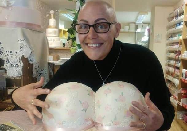 Toni with the special "bras cake" made by Iced for the launch