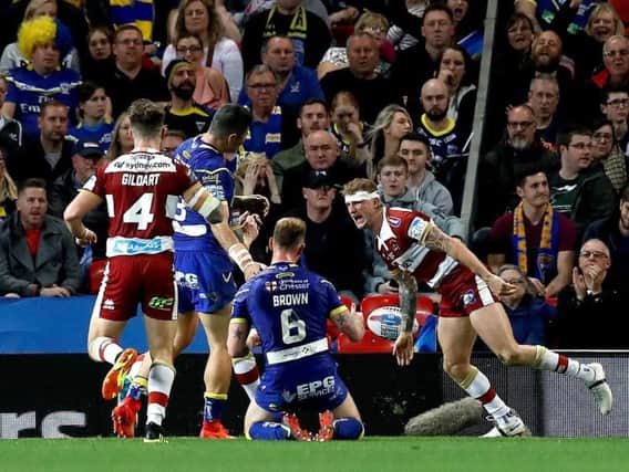 Dom Manfredi celebrates his second try which sealed the 2018 Super League title for Wigan