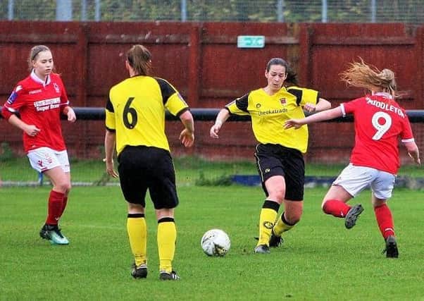 Megan Searson wins the ball against Forest as Lisa Topping (6) watches on