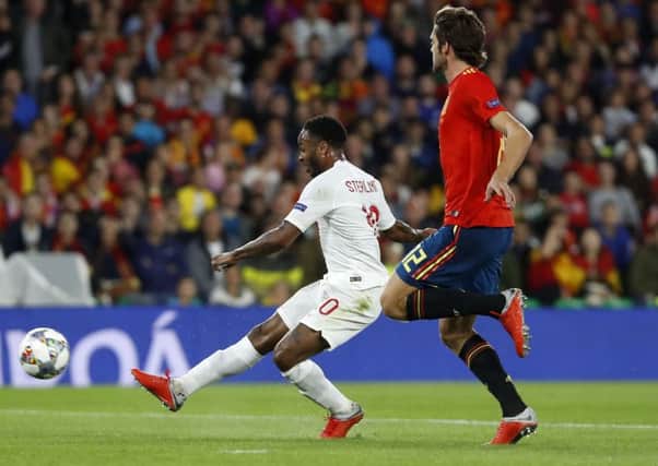 England's Raheem Sterling scores the opening goal against Spain in the UEFA Nations League