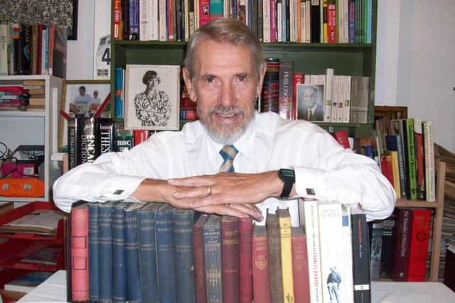 Chris Foote-Wood with photo of his sister Victoria Wood and his collection of books by Charles Dickens