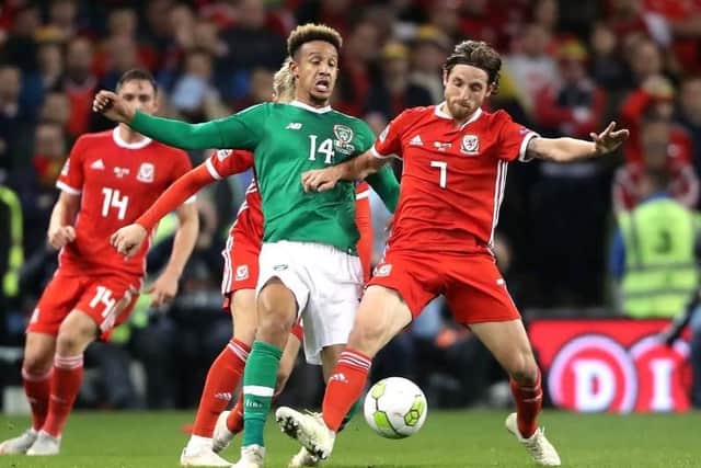 Callum Robinson battles with Joe Allen during the Republic of Ireland's defeat to Wales