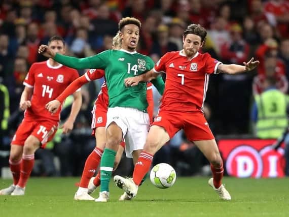 Callum Robinson battles with Joe Allen during the Republic of Ireland's defeat to Wales