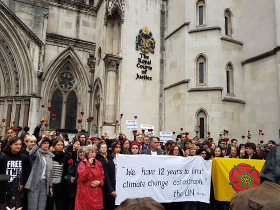 Protestors outside the Royal Court of Justice in central London