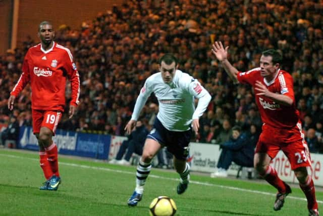 PNE winger Ross Wallace gets the better of Jamie Carragher