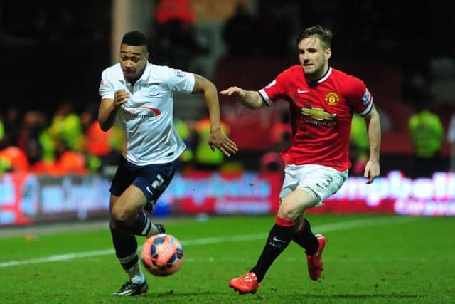 Chris Humphrey takes on Manchester United's Luke Shaw