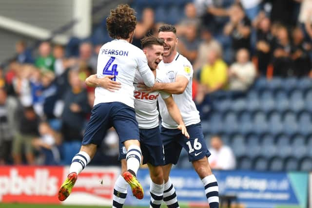 Preston midfielder Alan Browne is congratulated by Ben Pearson and Andrew Hughes sfter scoring against Bolton