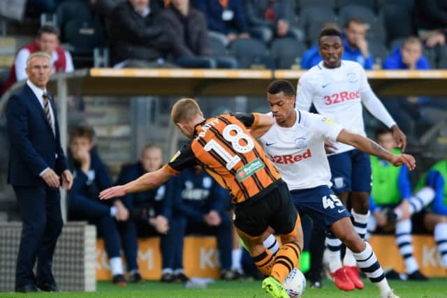 PNE striker Lukas Nmecha challenges with Hull midfielder Daniel Batty