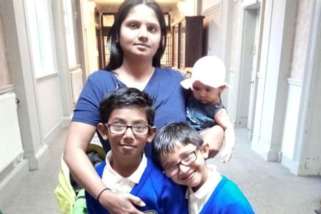 Mum Jayanti Raddy with newborn daughter Priya, Vinayak (left), eight, and Kartik, seven