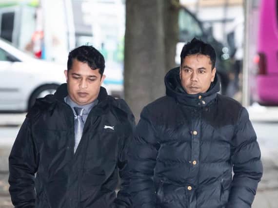 Harun Rashid (left), 38, and Mohammed Kuddus, 40, arrive at Manchester Crown Court. Photo: Danny Lawson/PA Wire