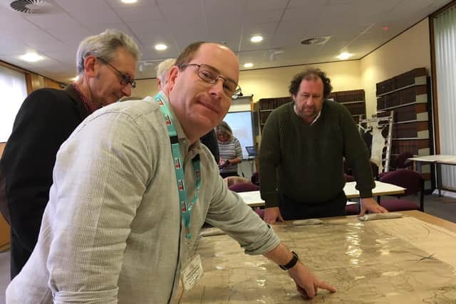 John Rogan shows archive visitors a range of maps