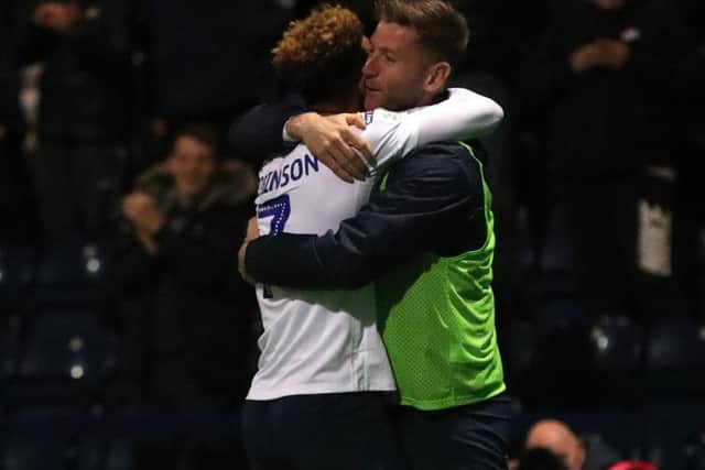 Paul Gallagher congratulates Robinson on his second and his PNE's fourth against Brentford