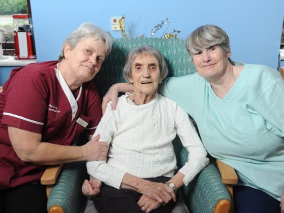 Doris Cooney celebrates her 103rd birthday at Cuerden Grange Nursing Home. She is pictured (centre) with staff Doris Schostag and Linda Traynor.