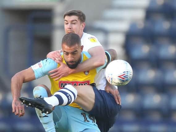 Paul Huntington battles with Rotherham's former Blackpool striker Kyle Vassell
