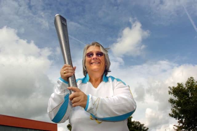 Marilyn Gregson with her torch for the London 2012 Paralympic Games