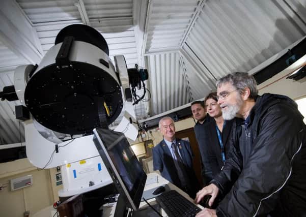 UCLan: Brother Guy Consolmagno SJ, the director of the Vatican Observatory, looking at data from the Moses Holden Telescope, watched by Jeremiah Horrocks Institute Director Professor Derek Ward-Thompson, astronomy academic Dr Mark Norris and trip organiser Shirley Russo.