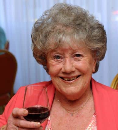 Pam Thomas raises a glass