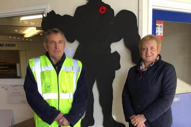 Peter Lambert and Sue Cornthwaite from Longridge Timber with one of the soldier figures