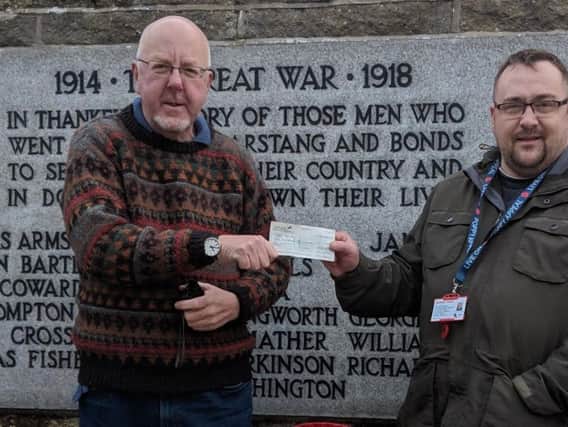 Anthony Coppin (left) presenting the poppy apeal donation to David Brewin
