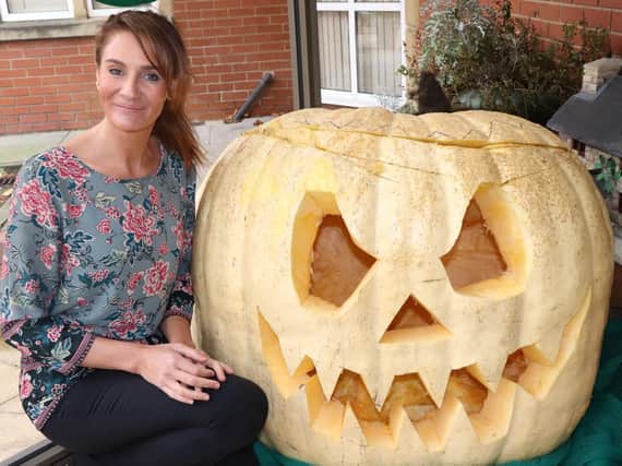 Gillian Hope with the humongous pumpkin