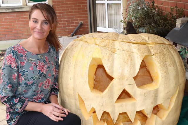Gillian Hope with the humongous pumpkin