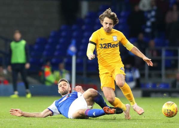Preston North End's Ben Pearson is tackled by Ipswich Town's Cole Skuse
