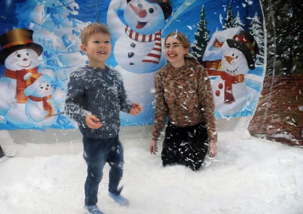 A Winter Sparkle event in aid of Derian House was held at Astley Hall in Chorley.
3 year-old Cooper Wilson with mum Romy in the giant snow globe.  PIC BY ROB LOCK
4-11-2018