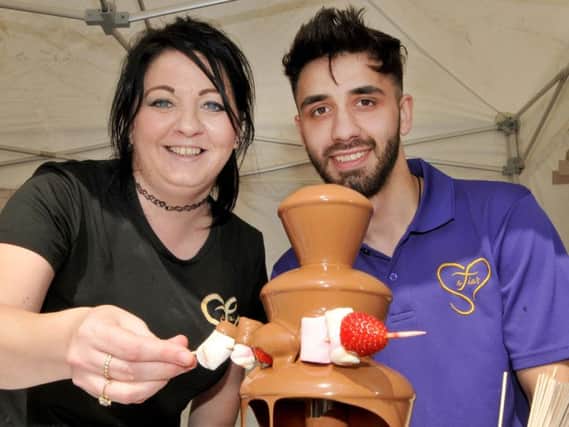 Hayley Todd and Imran Ali and a chocolate fountain at Safia's at the Taste of Food and Drink Festival, Leyland.