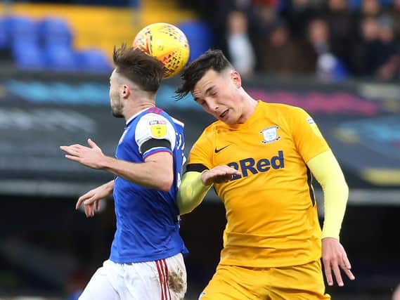Josh Earl battles with Ipswich Town's Gwion Edwards at Portman Road on Saturday