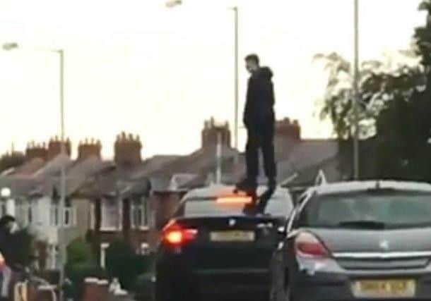 Residents in Ashton-on-Ribble say they are being terrorised by rival gangs whose behaviour is going unchecked by police.  It comes after a video, which has garnered more than 2,000 shares online, shows a youth standing on a car in the middle of Blackpool Road holding up motorists.
