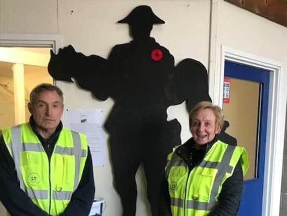 Longridge Timber's Pete Lambert and Sue Cornthwaite with one of the town's First World War Tommies