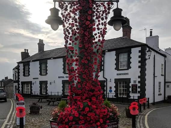 The Market Cross tribute in Garstang and poppies on posts
