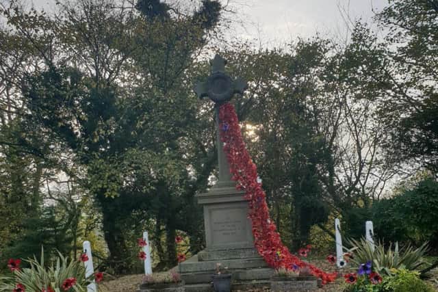 The memorial at Calder Vale has been decorated with a  river of poppies in advance of  Remembrance Day