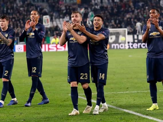 Manchester United's players celebrate in Turin
