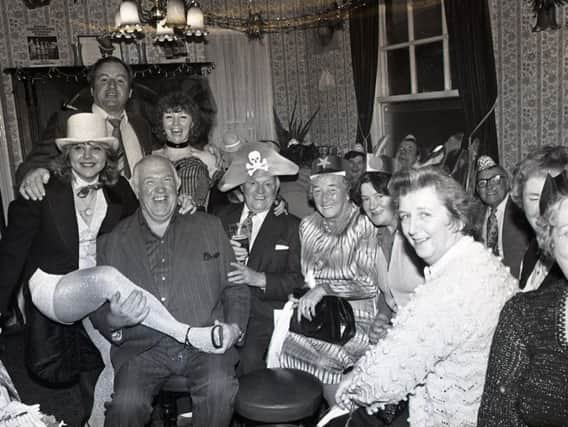 Love Thy Neighbour star Paul Luty, who played barman Nobby, is pictured with pensioners at the Lane Ends pub Christmas party. Also pictured are comedian Walter Horam and landlady Liz Curran