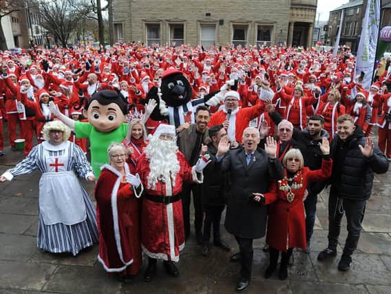 Santas take on Jingle All The Way walk from Chorley to Rivington Pike for childrens hospice Derian House