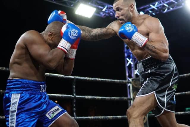 Damian Chambers goes on the attack against Elvis Dube. Picture: Chris Roberts for MTK Global