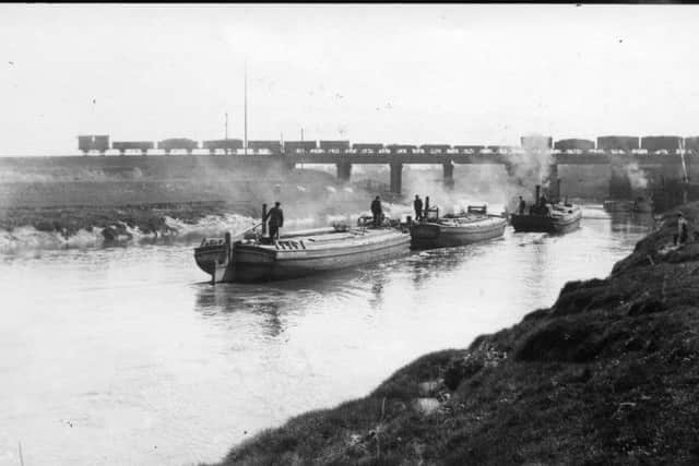 Shipping on the River Douglas circa 1900 with the viaduct in the background which carried the former Southport - Preston Railway 
Photo courtesy of Lancashire County Council's Red Rose Collections