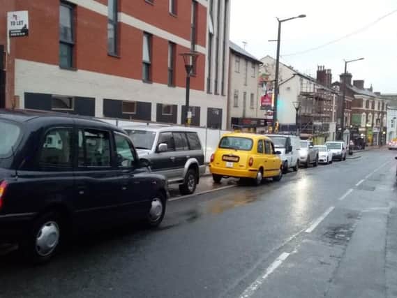 Cars parked in a taxi rank in Preston city centre. Cabbies have said a lack of council traffic wardens is making the problem worse not better