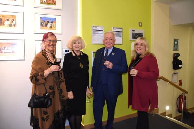 Trustees and members of Preston Playhouse celebrating the completion of major works to update and improve the foyer areas of the theatre.