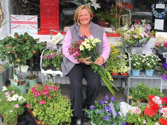 Sara Barrow outside her shop 'Flowers With Passion'.