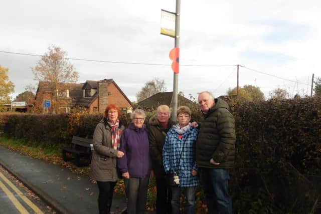 Residents at a soon to be redundant bus station in Heskin