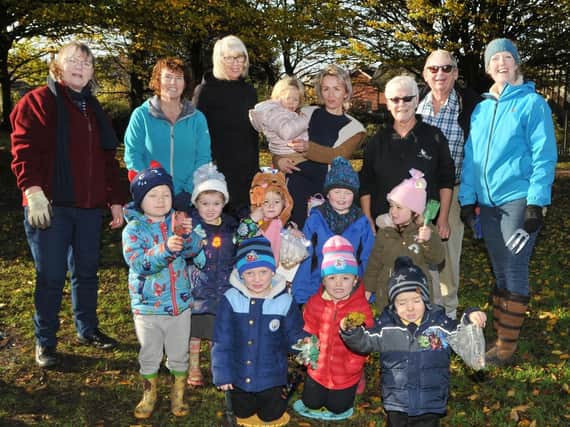 The youngsters took turns to plant bulbs in the green space with help from project organiser Jo Hindle-Taylor and Leyland councillors Ken and Sue Jones