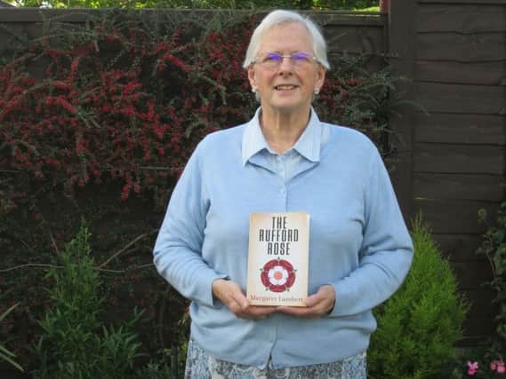 Margaret Lambert with her book, The Rufford Rose